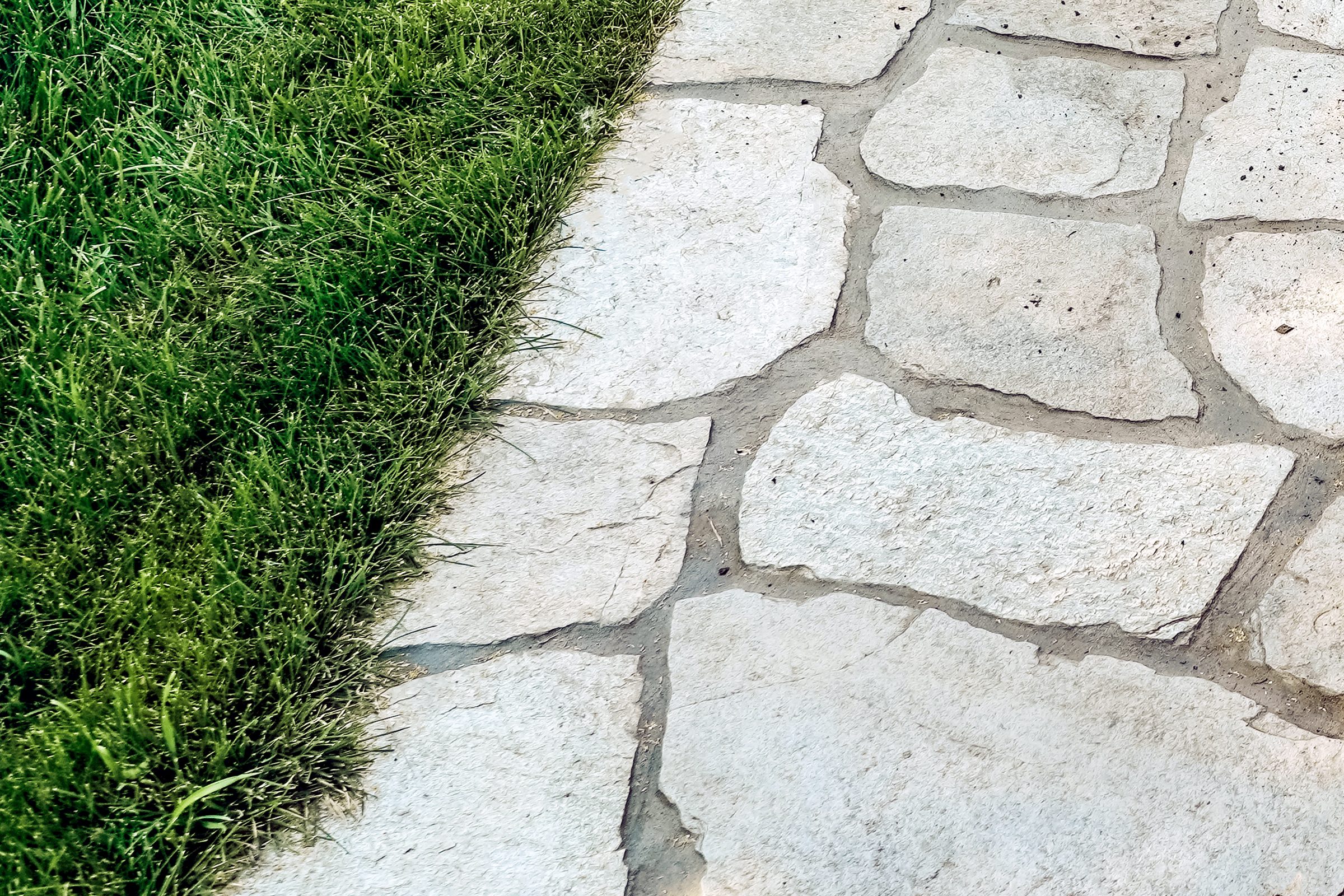 Flat stone border next to grass