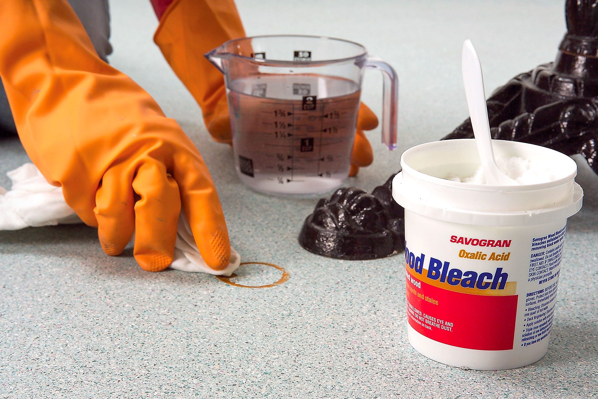 A Person Removing Tough Stains from Vinyl Flooring