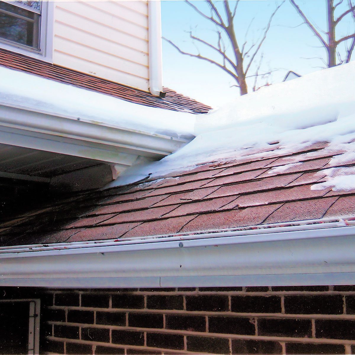 Snow on roof of house