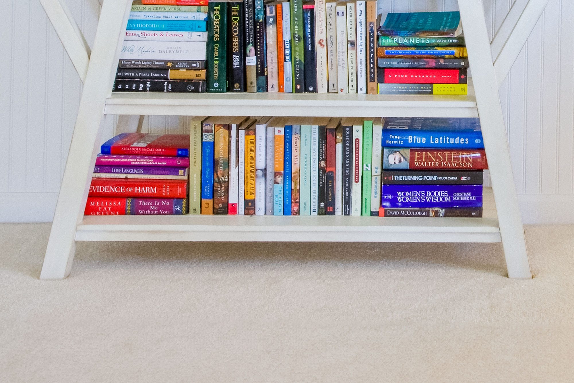 A Bookcase On Floor Carpeting