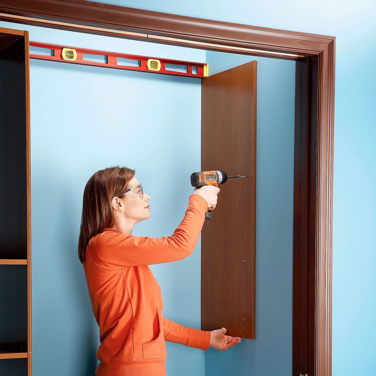 woman installing wall panels