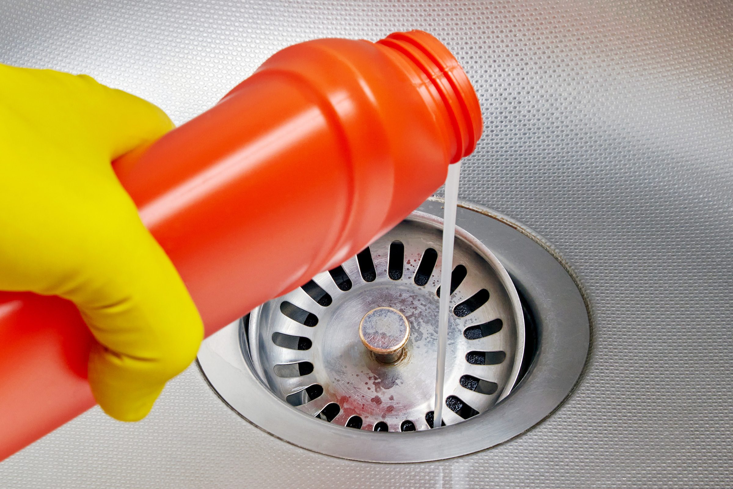 pouring pipe cleaner down sink drain