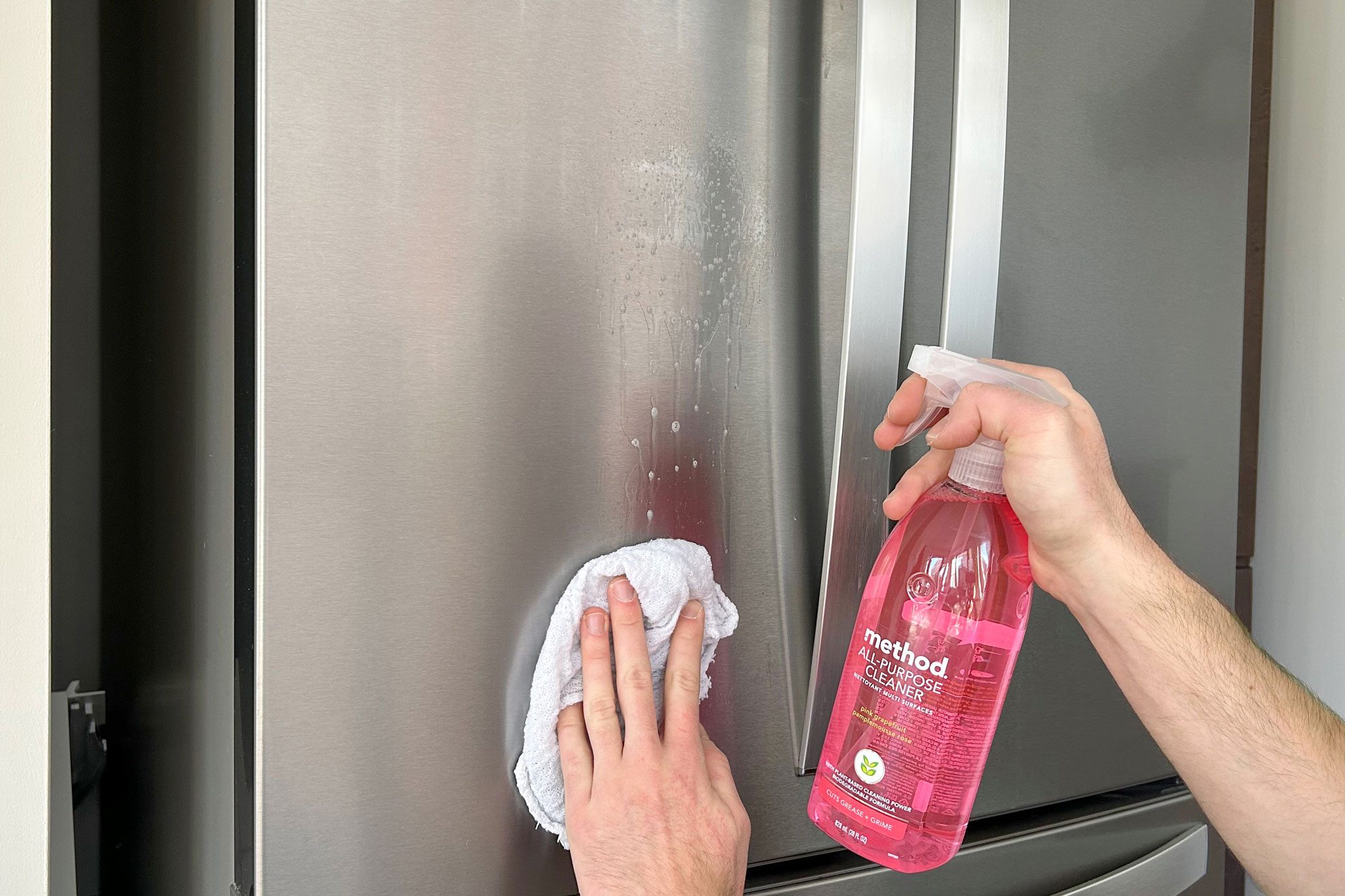 a person cleaning a Refrigerator