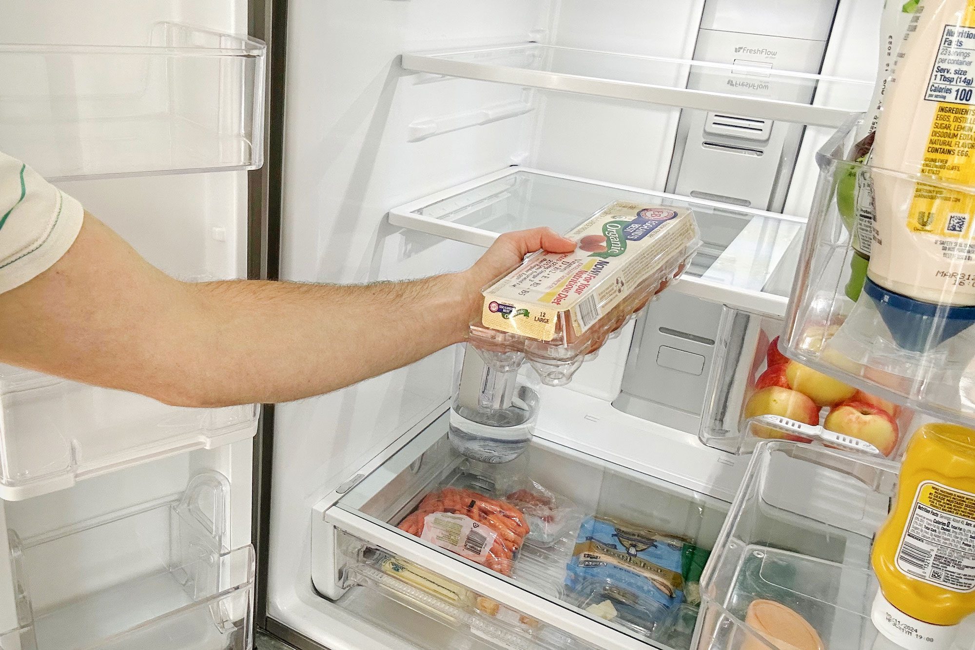 a person emptying the refrigerator