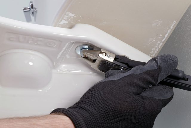 Removing toilet tank