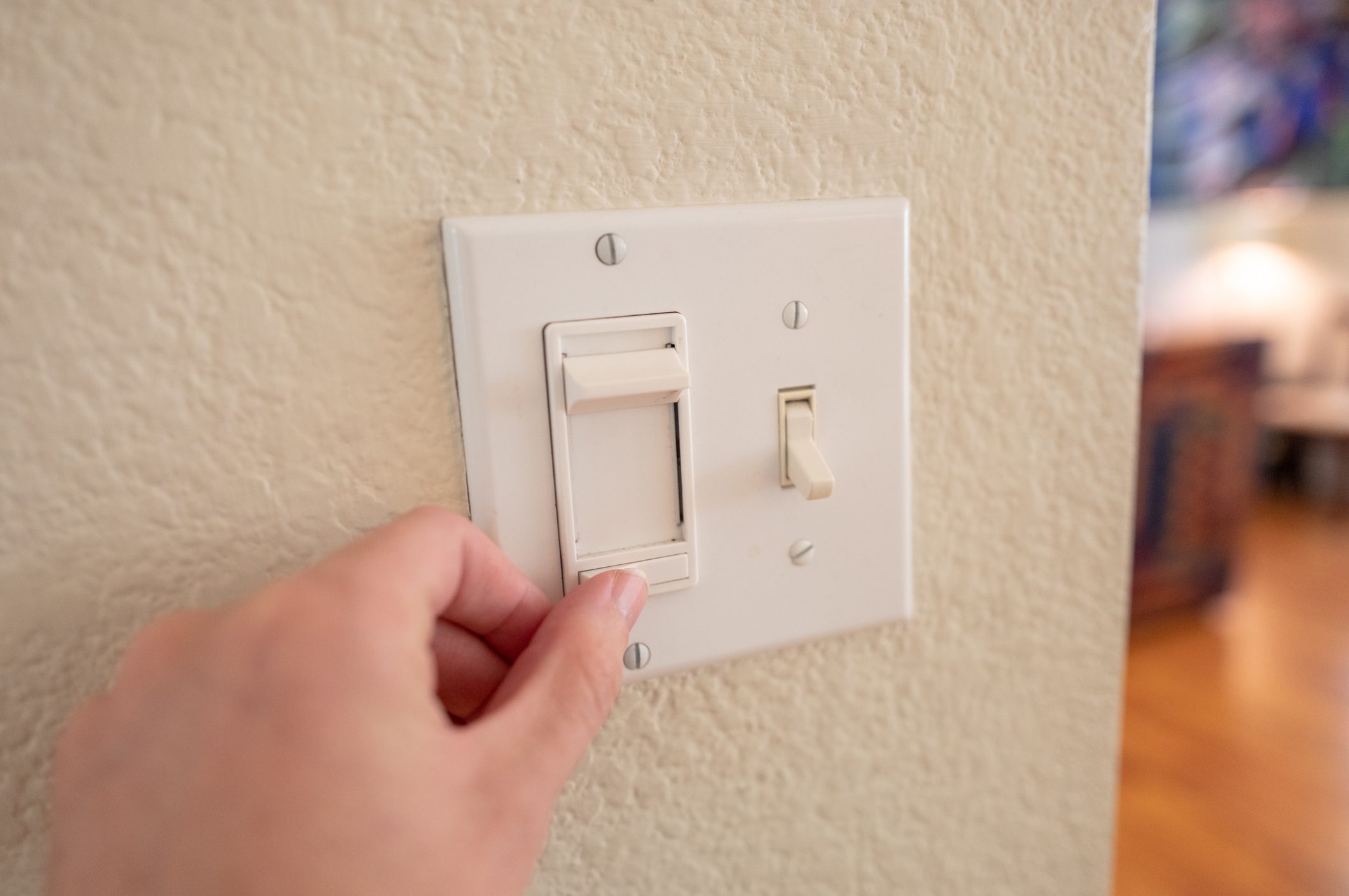 POV Man Adjusting Dimmer Switch