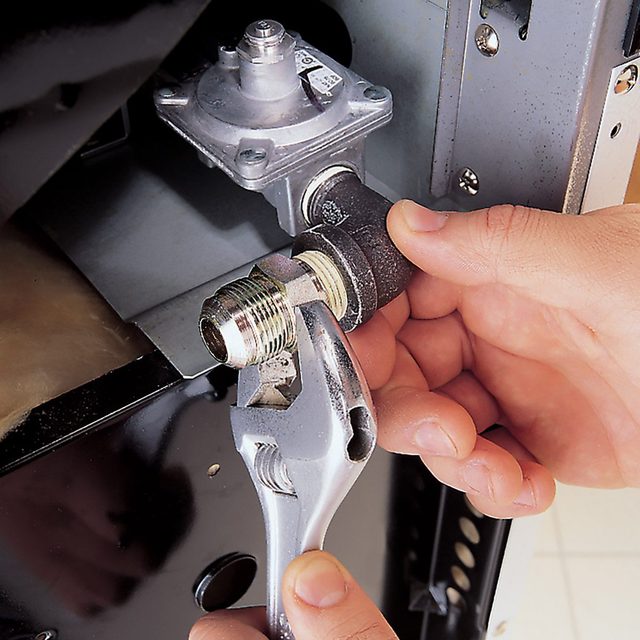 Using adjustable wrench to tighten the connector