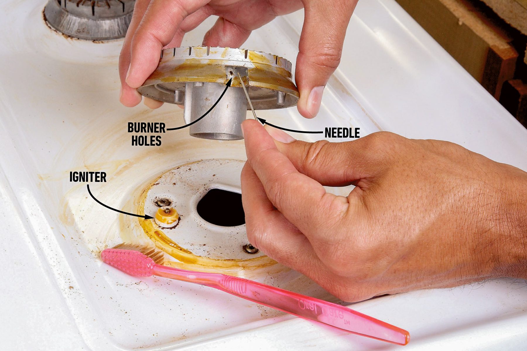 Clean The Gas Stove Igniter And Burner Holes 