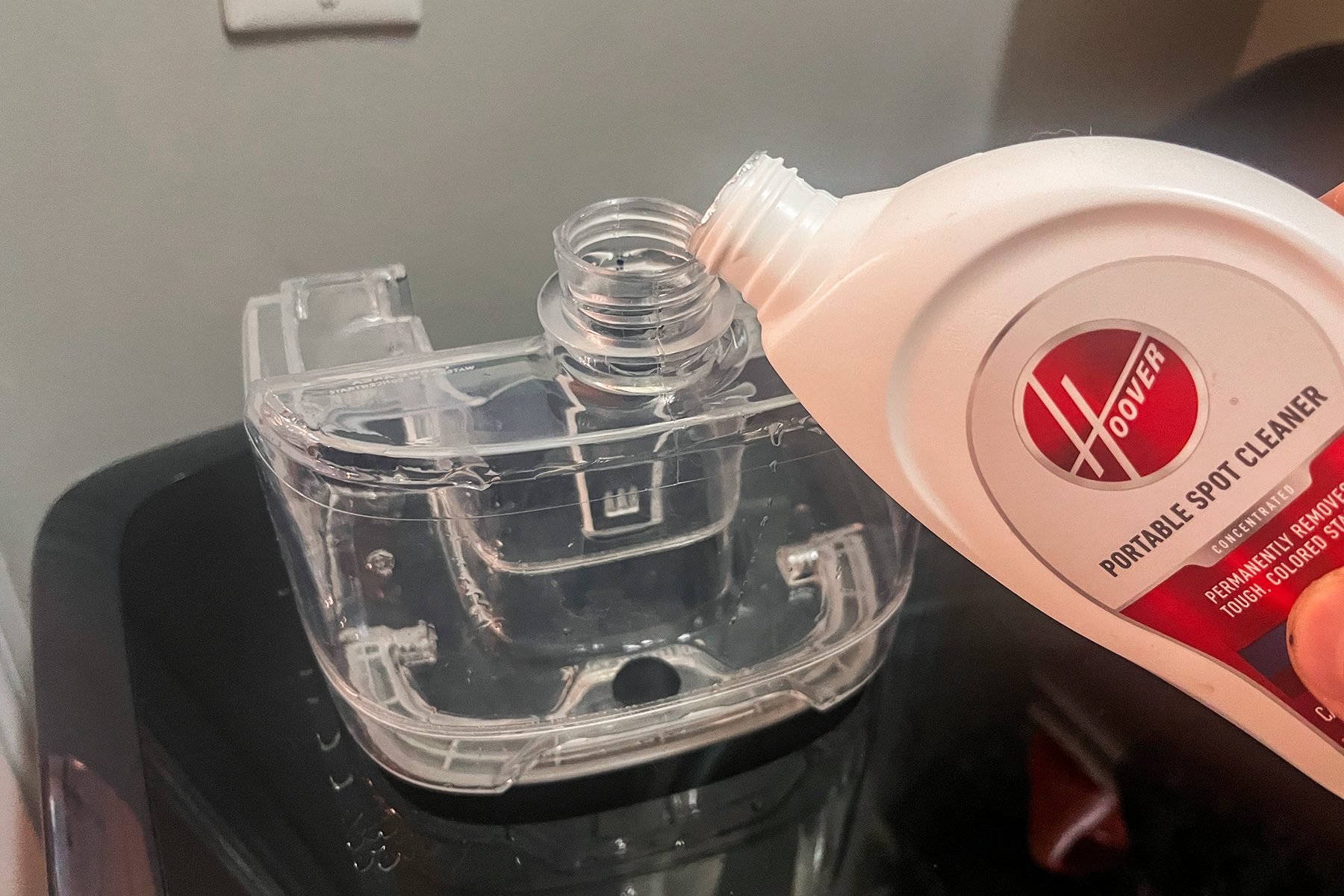 Filling up tank of Hoover Clean Slate