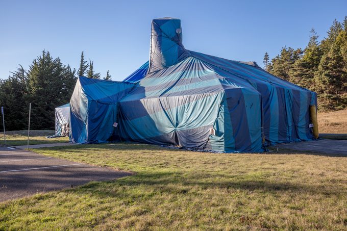 Fumigation termite bug tent wrapped covereing on large house building