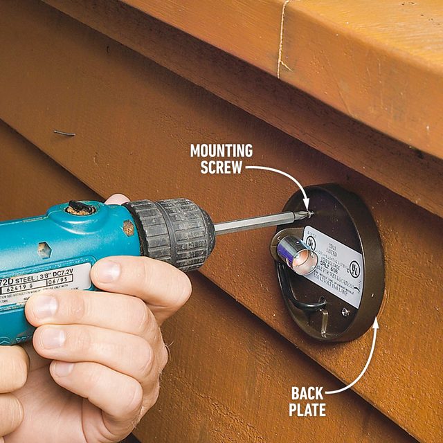 How To Install Low Voltage Deck Lighting Fasten the back plate