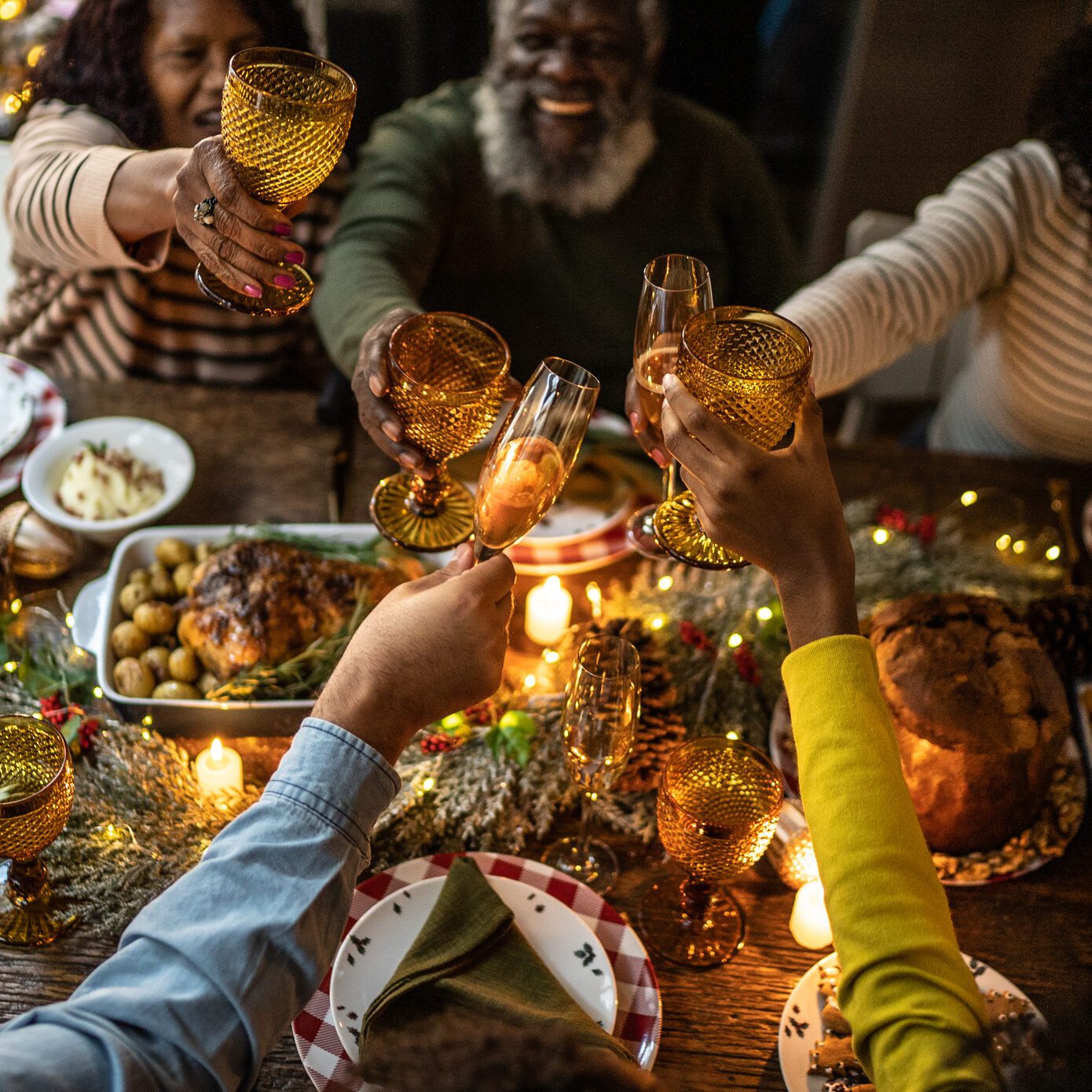 Family toasting on Christmas dinner at home