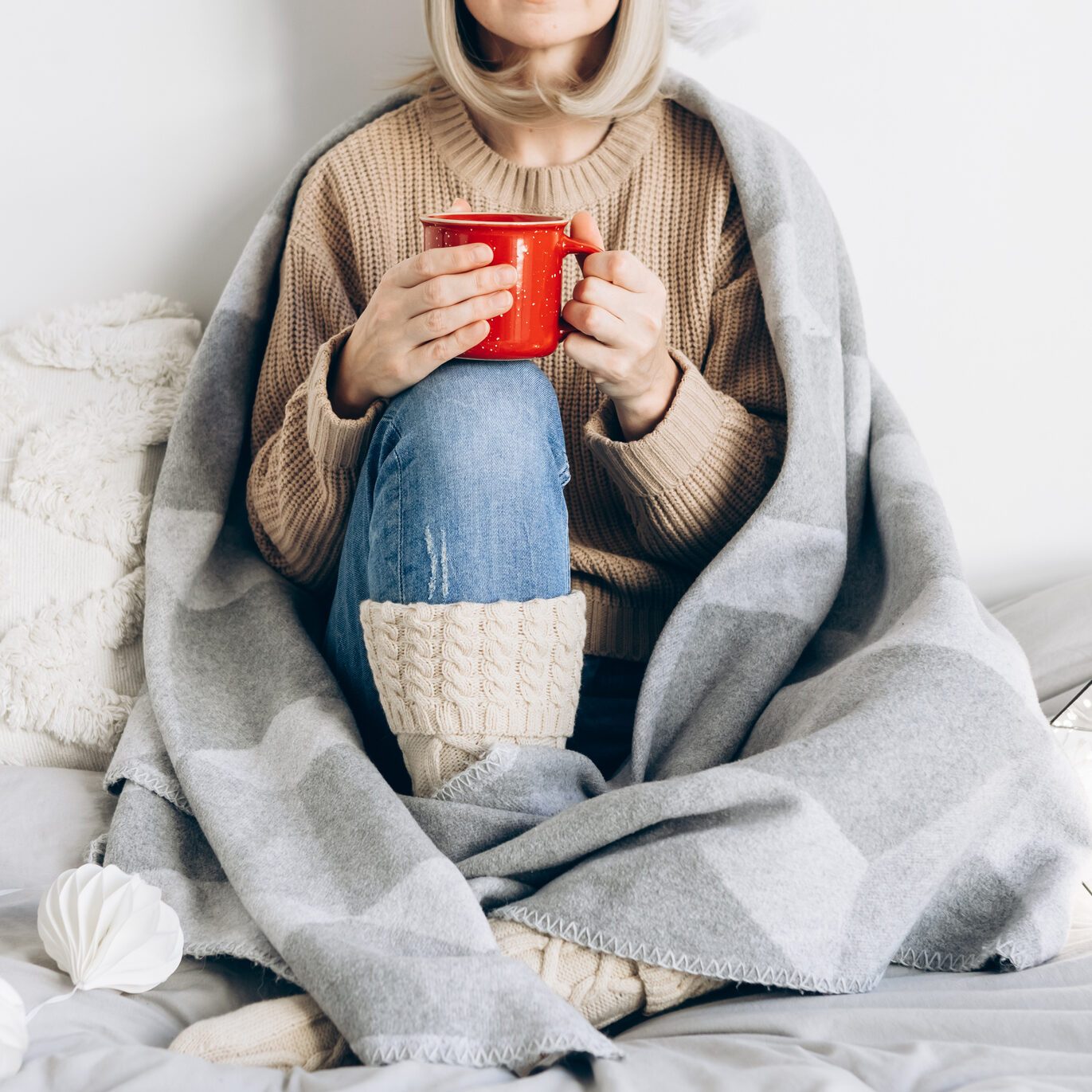 Cropped blonde woman in warm clothes
