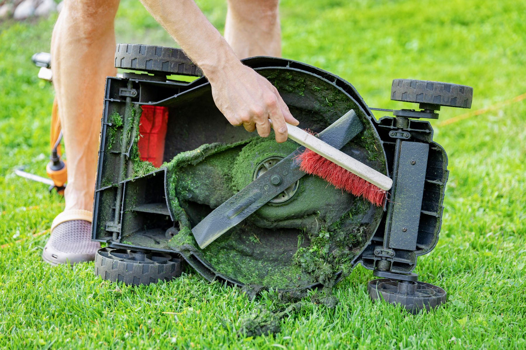 cleaning lawn mower with brush