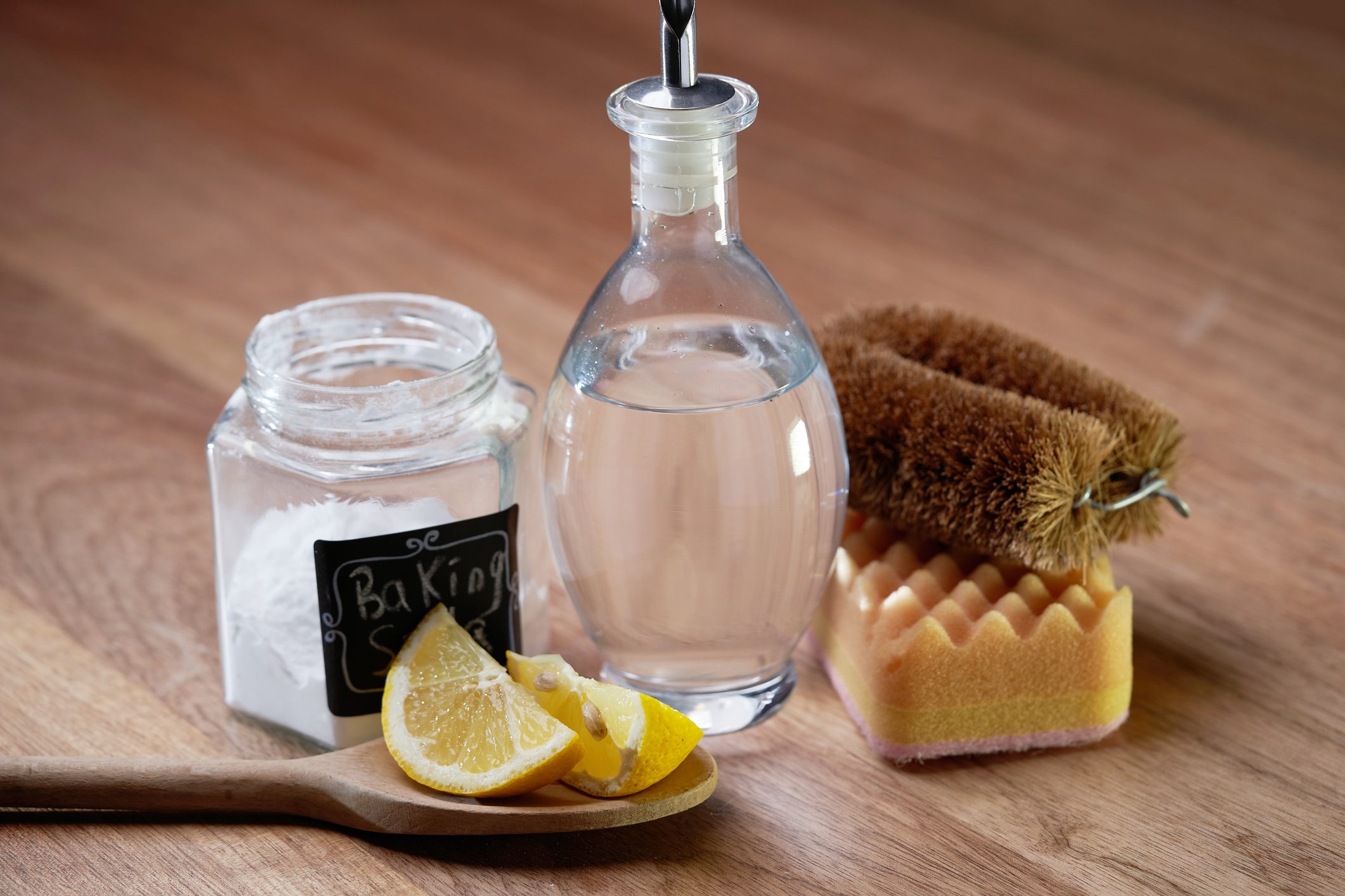 White vinegar baking soda and lemon on wooden table top,Malaysia