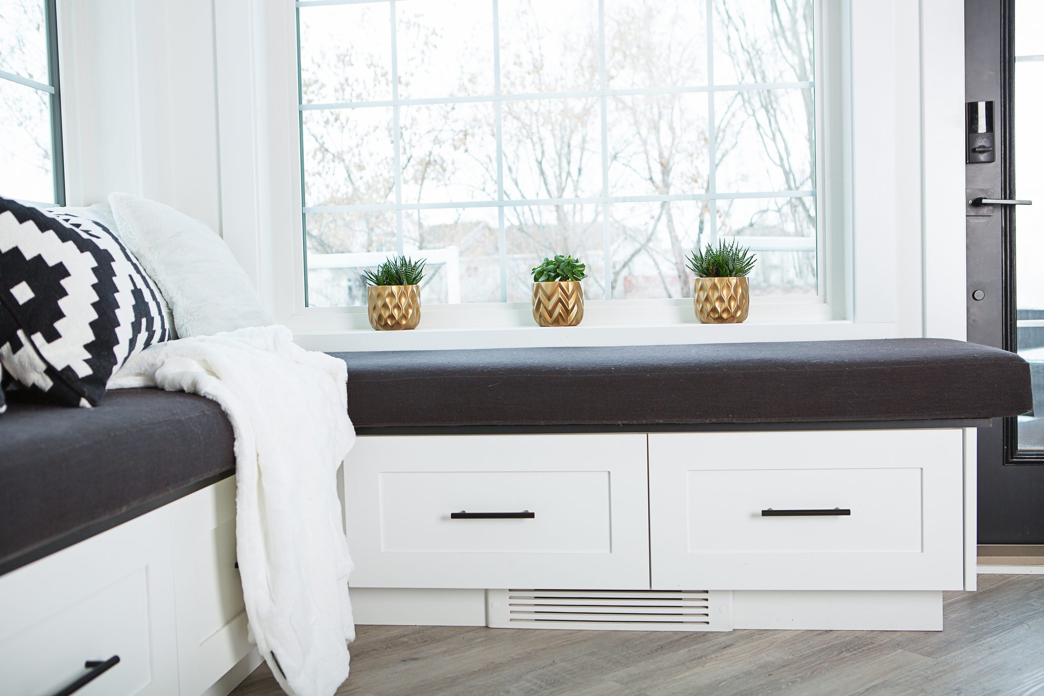 Three Succulent Plants In Gold Pot On Window Sill