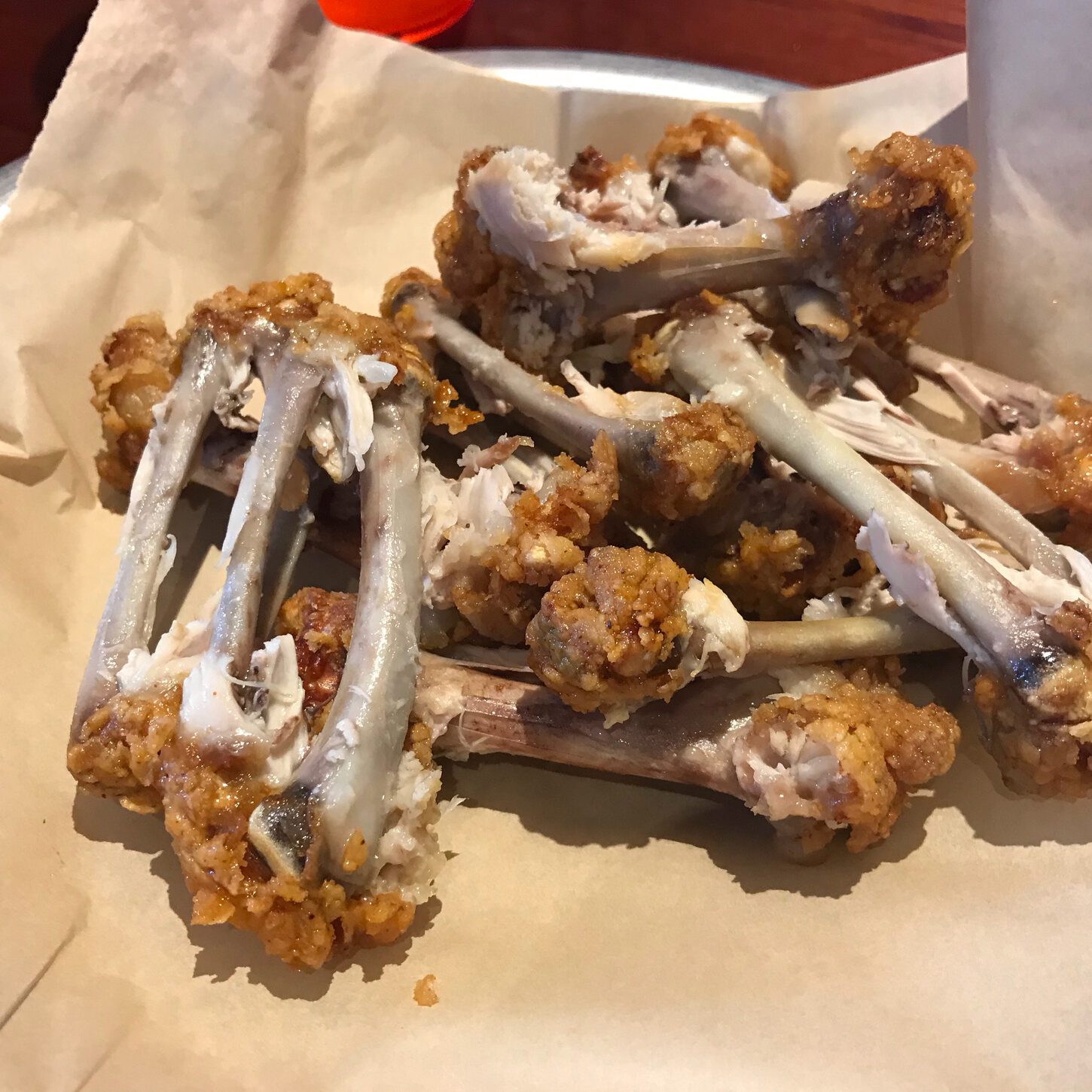 Plate of leftover chicken wing bones