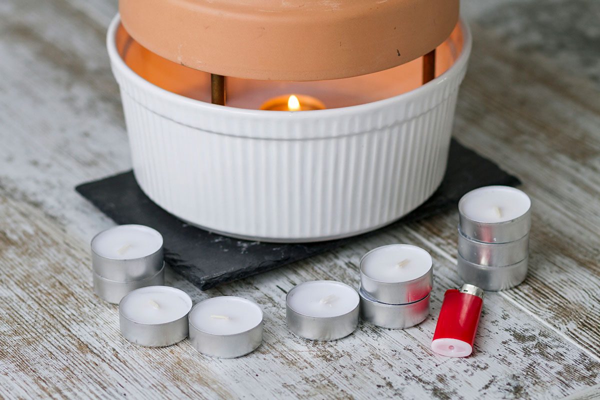 homemade heater made with candles and flower pot