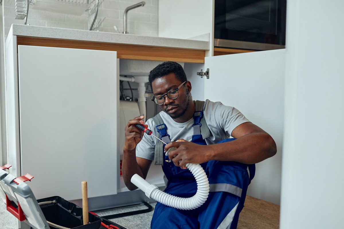 plumber inspecting pipe