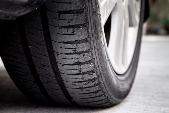 old car bald tire with very little tread remaining