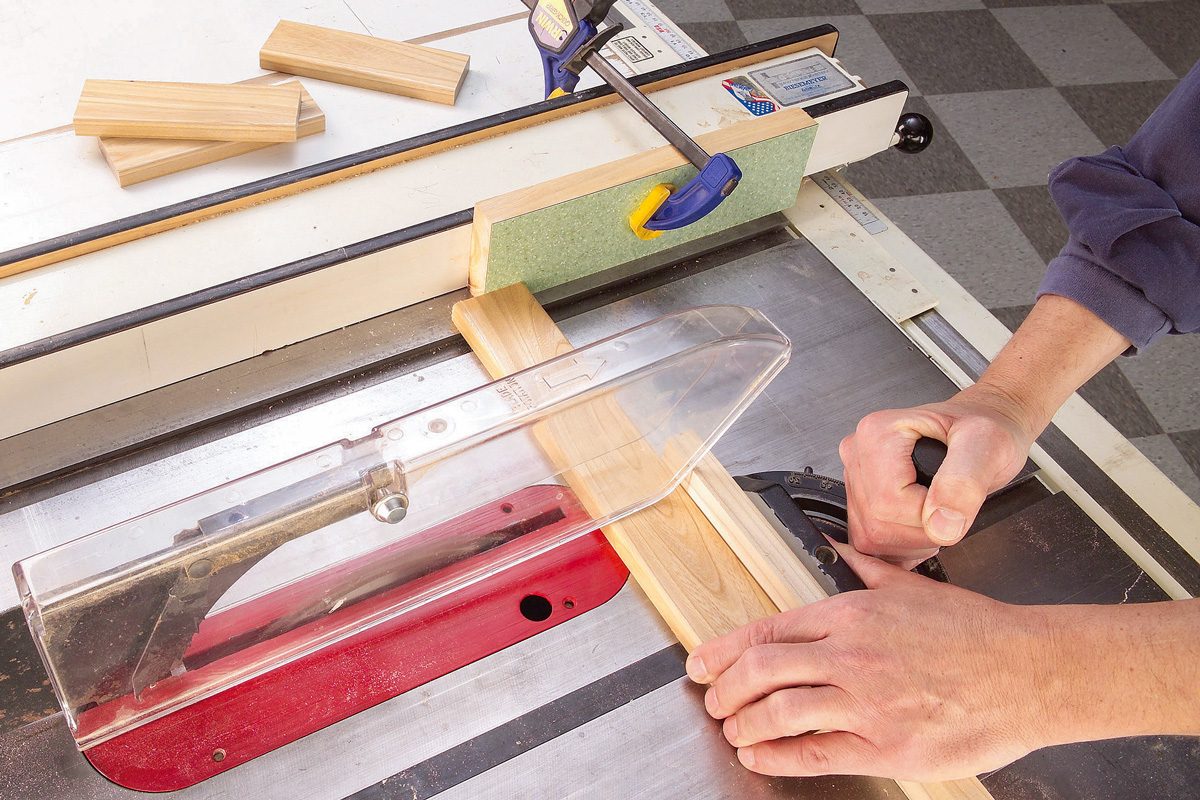 one inch thick wooden block clamped to table saw fence