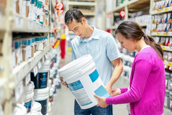 couple buying paint at a store