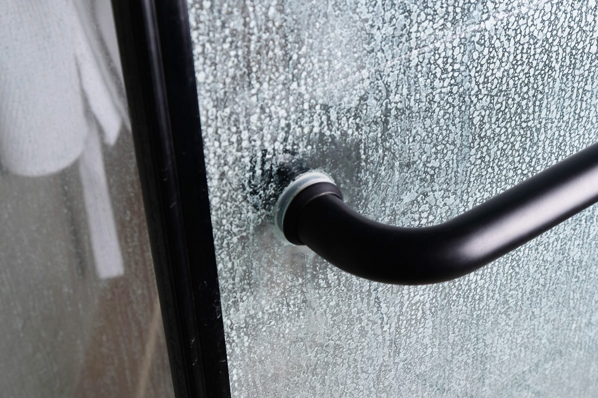 Limescale on transparent glass of shower cabin