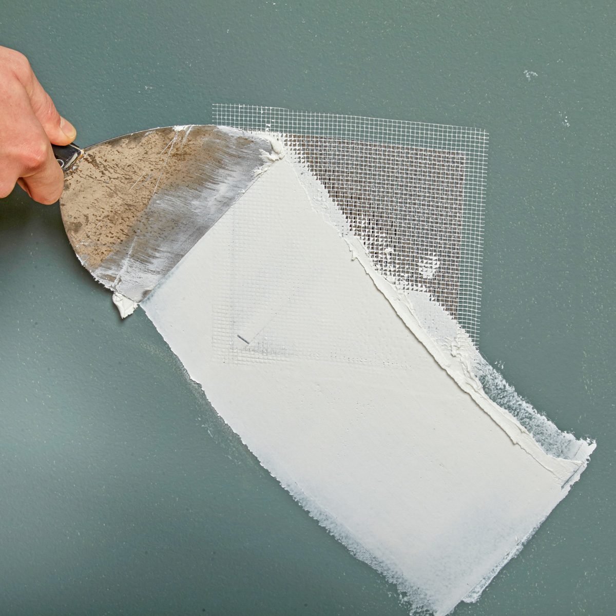 covering stick-on mesh patch with joint compound