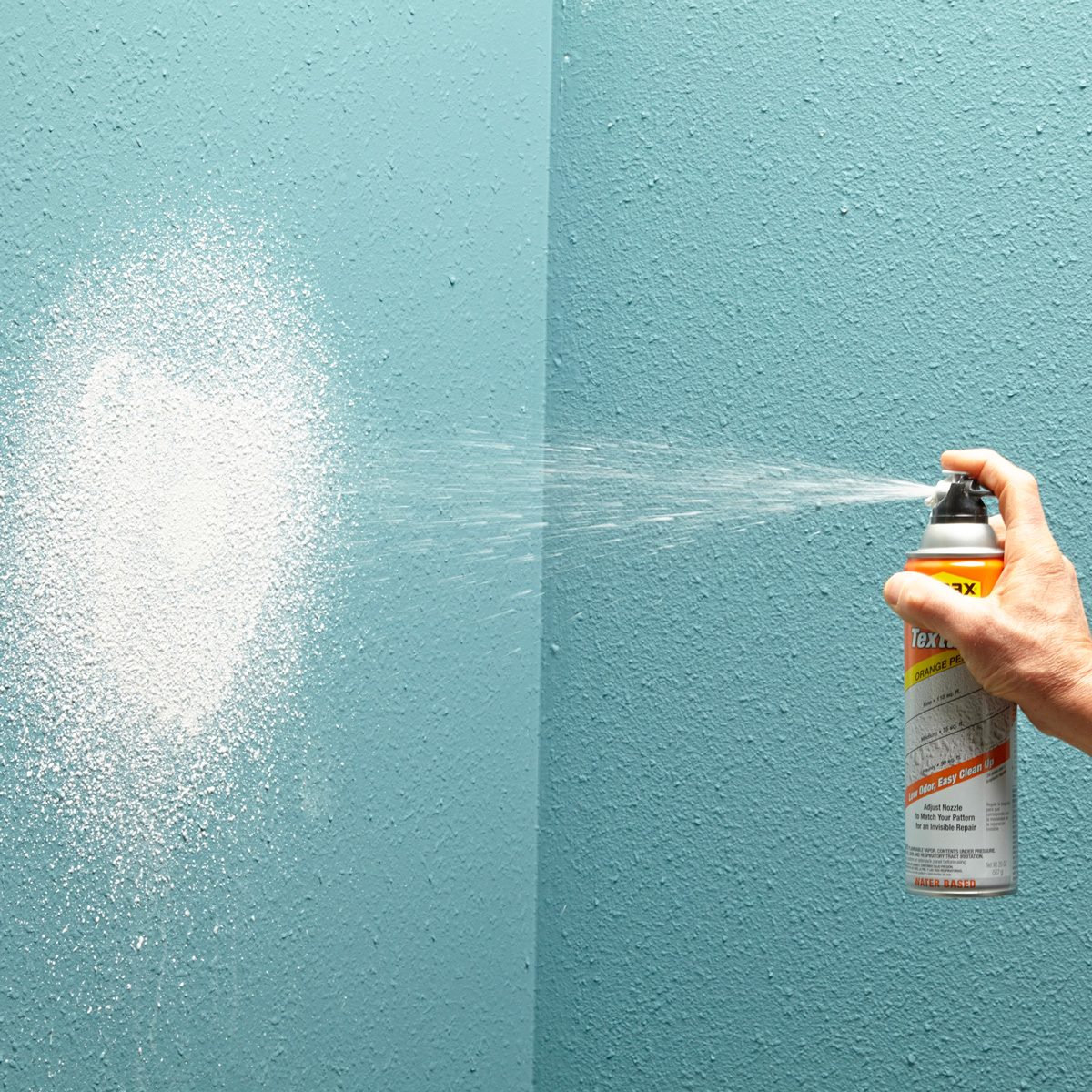 spray-on orange peel patch being used on a wall